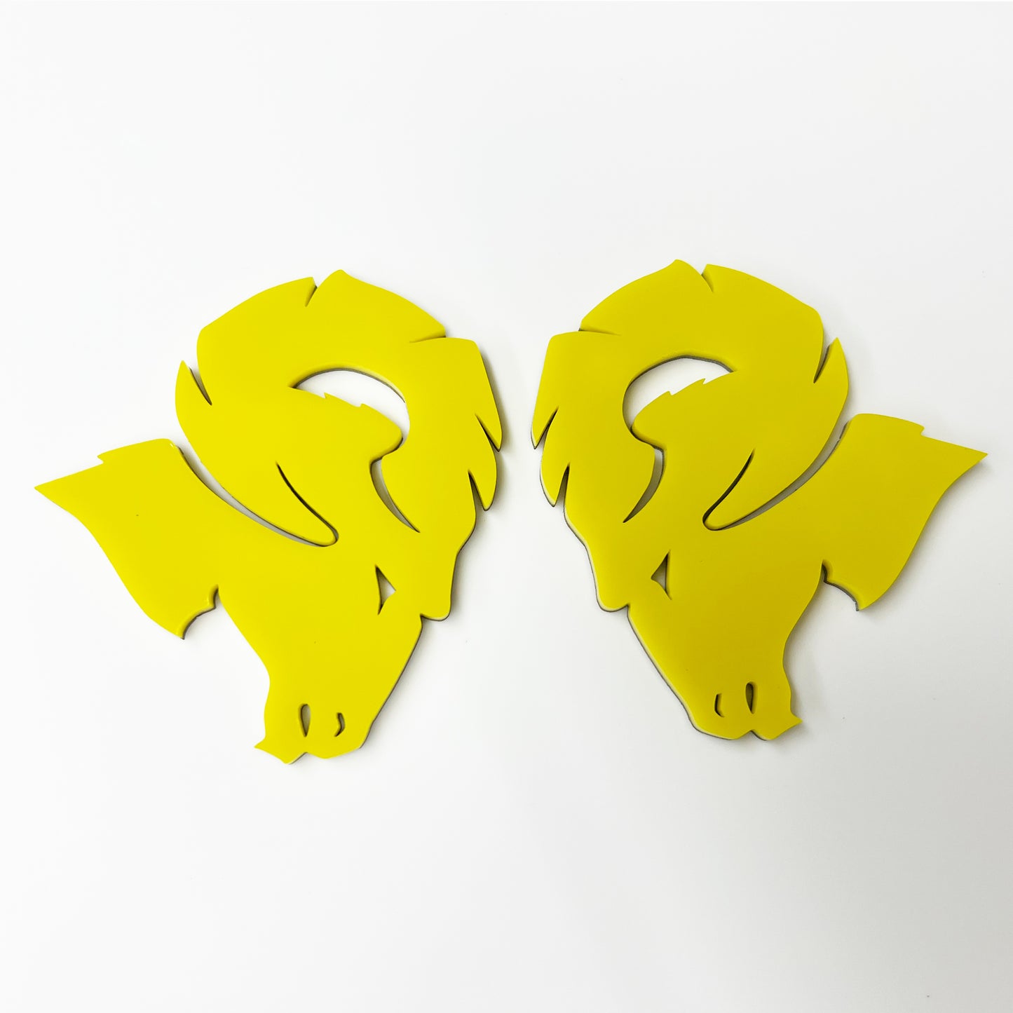 Pair of yellow Custom Dodge Ram Hellcat Emblem badges by FMSgear on white background