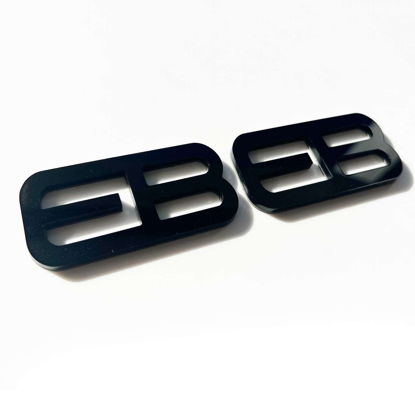Black custom emblems Ford Mustang f-150 from FMSgear with bold modern design on white background