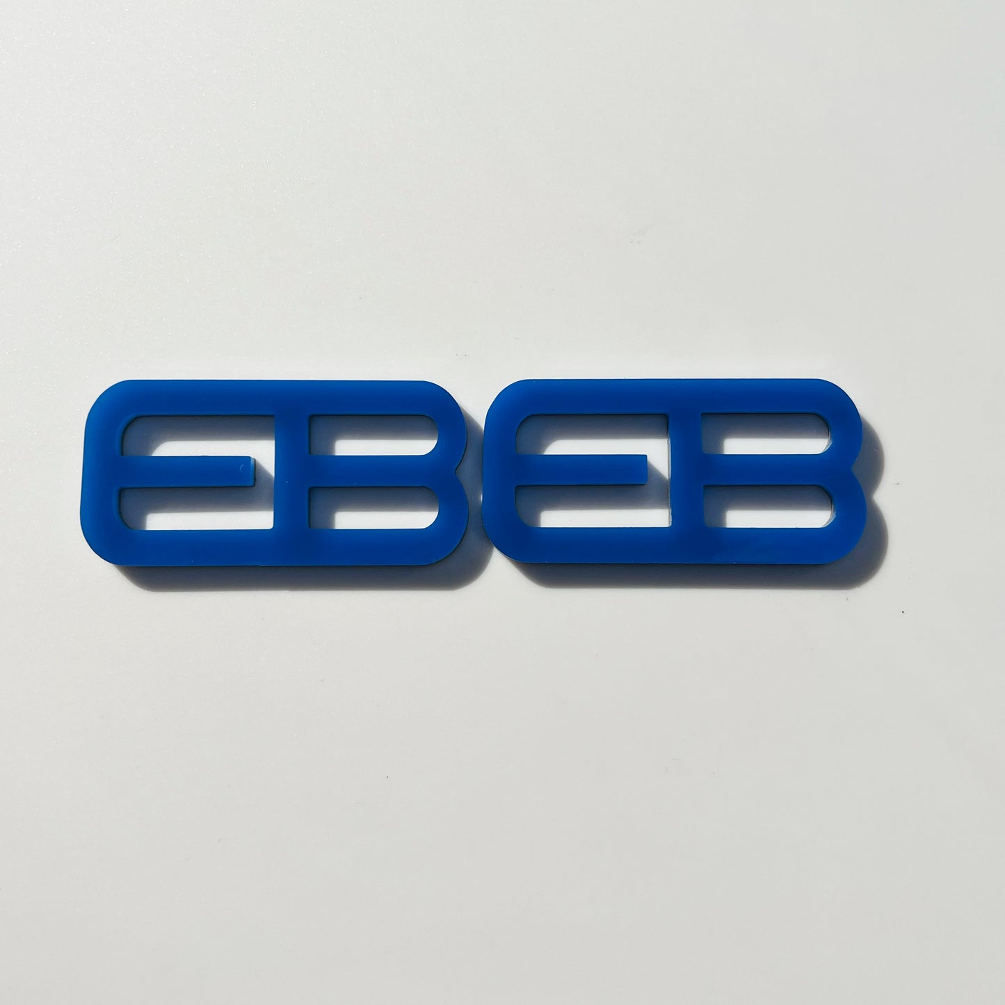 FMSgear custom emblems Ford Mustang f-150 blue double E design on white background