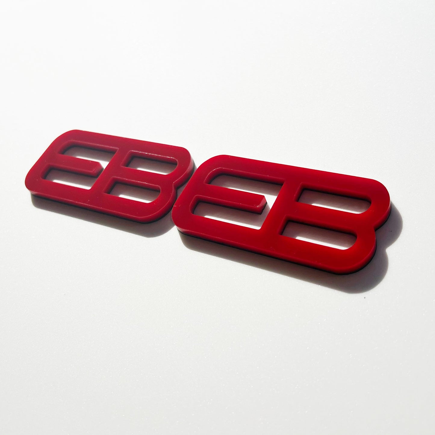 FMSgear red custom emblems Ford Mustang f-150 with bold modern design on white background