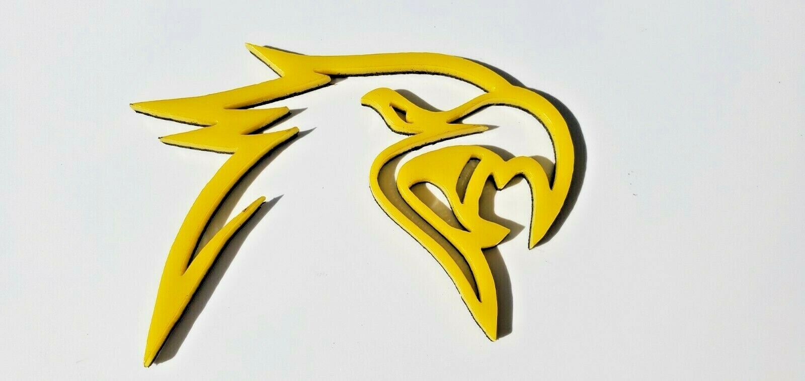 Custom HELLHAWK emblems for Jeep featuring a yellow aggressive hawk head design by FMSgear