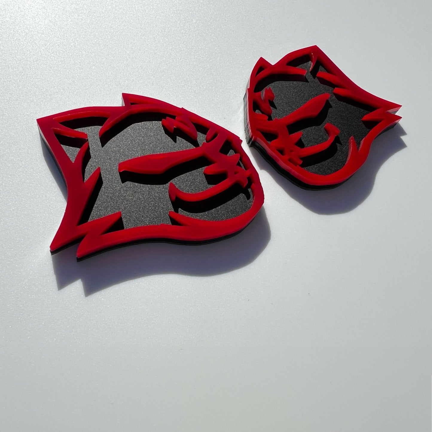 Custom HellKitten emblems for Dodge in red and black by FMSgear on a white background
