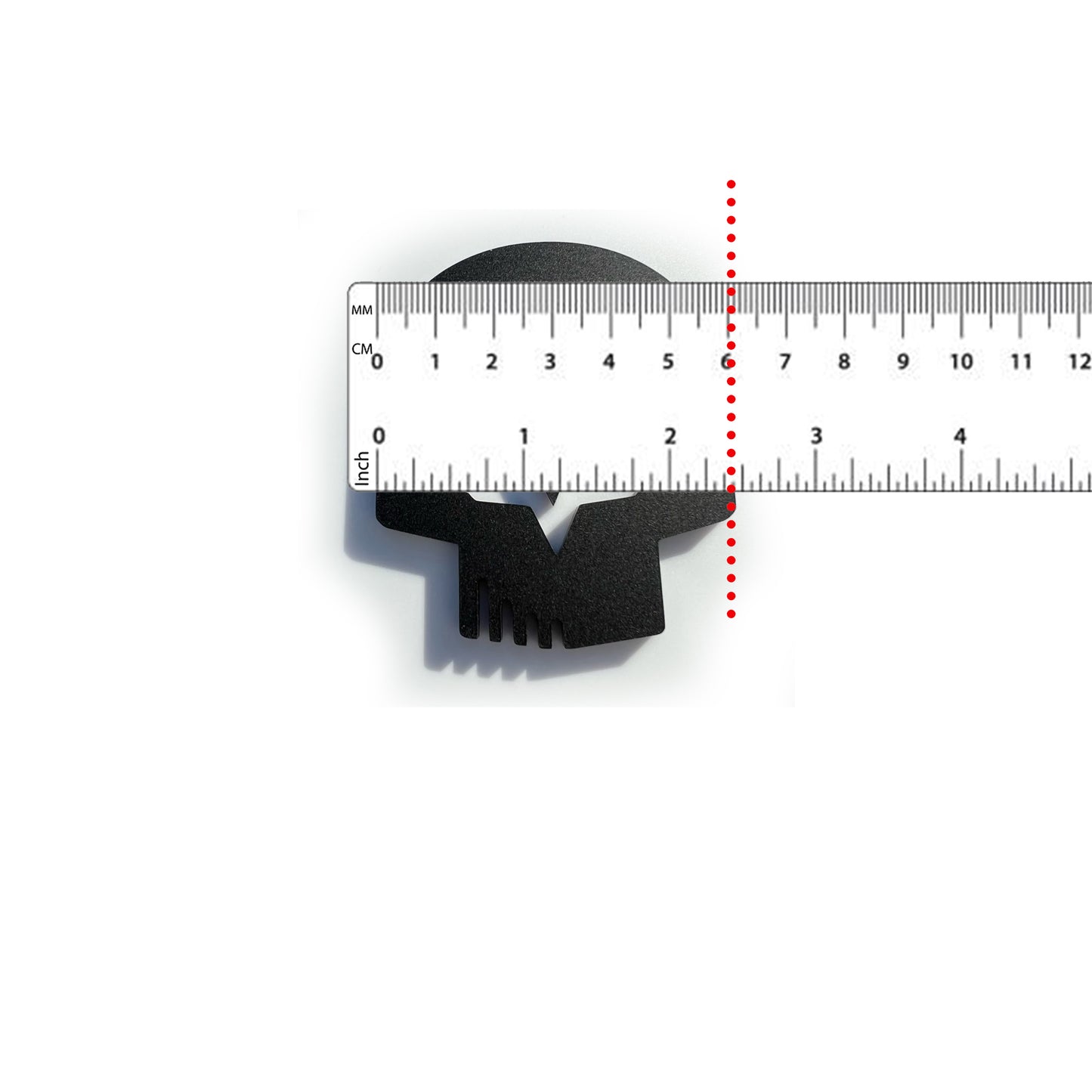 Black Jake skull badge for Corvette emblem shown next to ruler for size reference