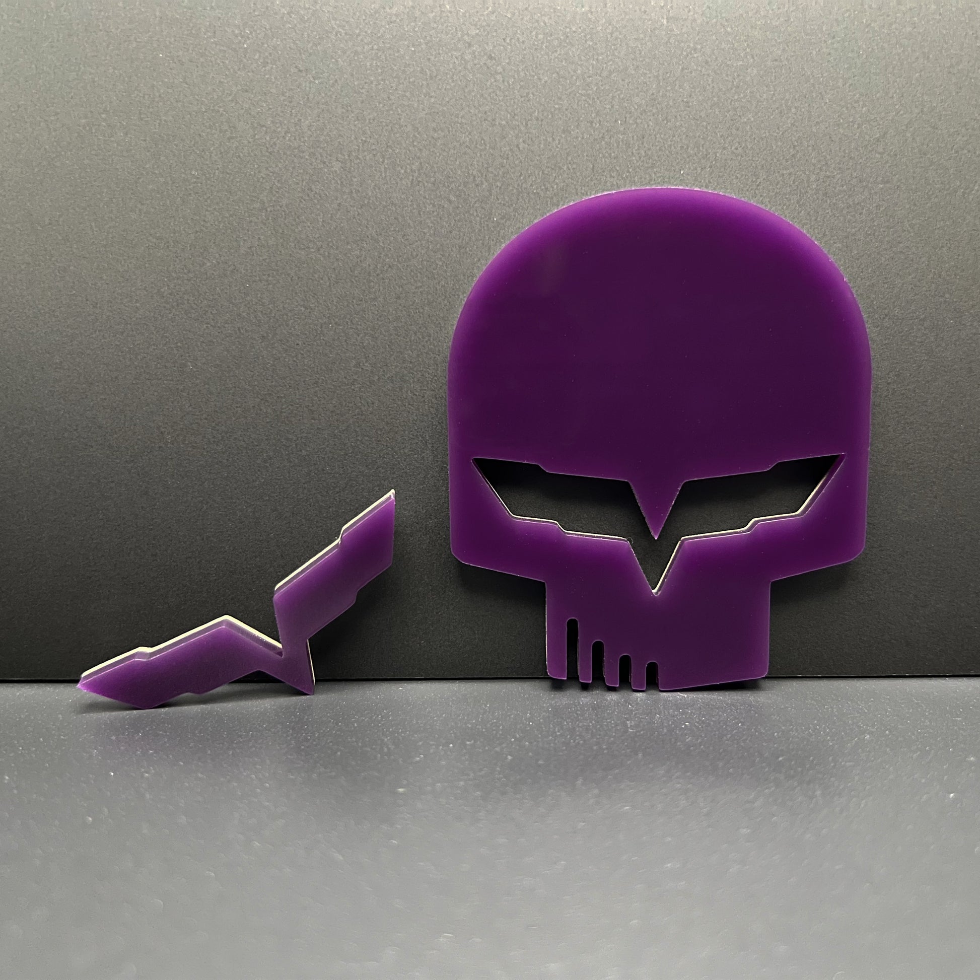 Purple Jake skull badge for Corvette emblem set by FMSgear on gray background